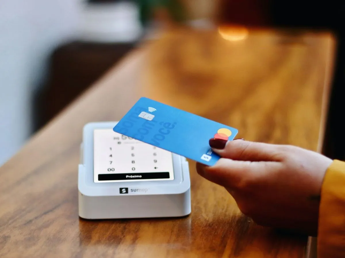 Customer paying with a bank card at a card reader
