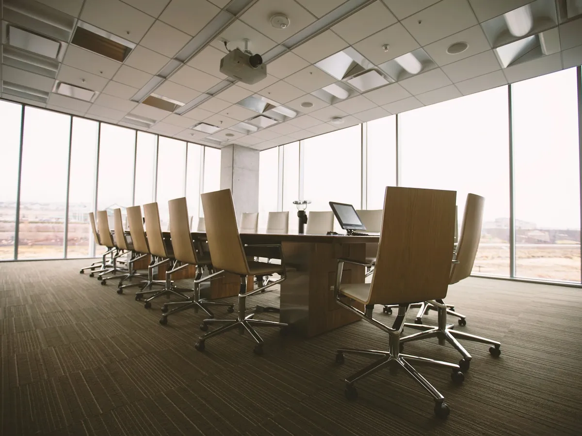 Senior business partners collaborating in a modern conference room