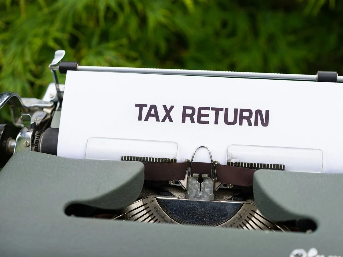 Typewriter with a sheet of paper reading Tax Return